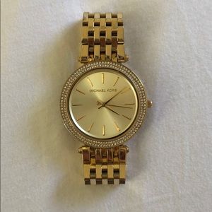 Gold women’s Michael kors watch
